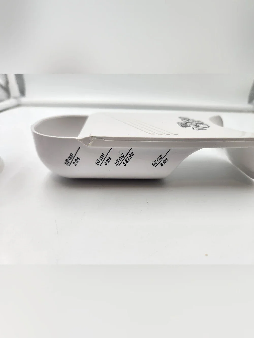 3 Pampered Chef measuring cups. A Measure All 2 Cup,a 1/2 Cup scoop, Tablespoon